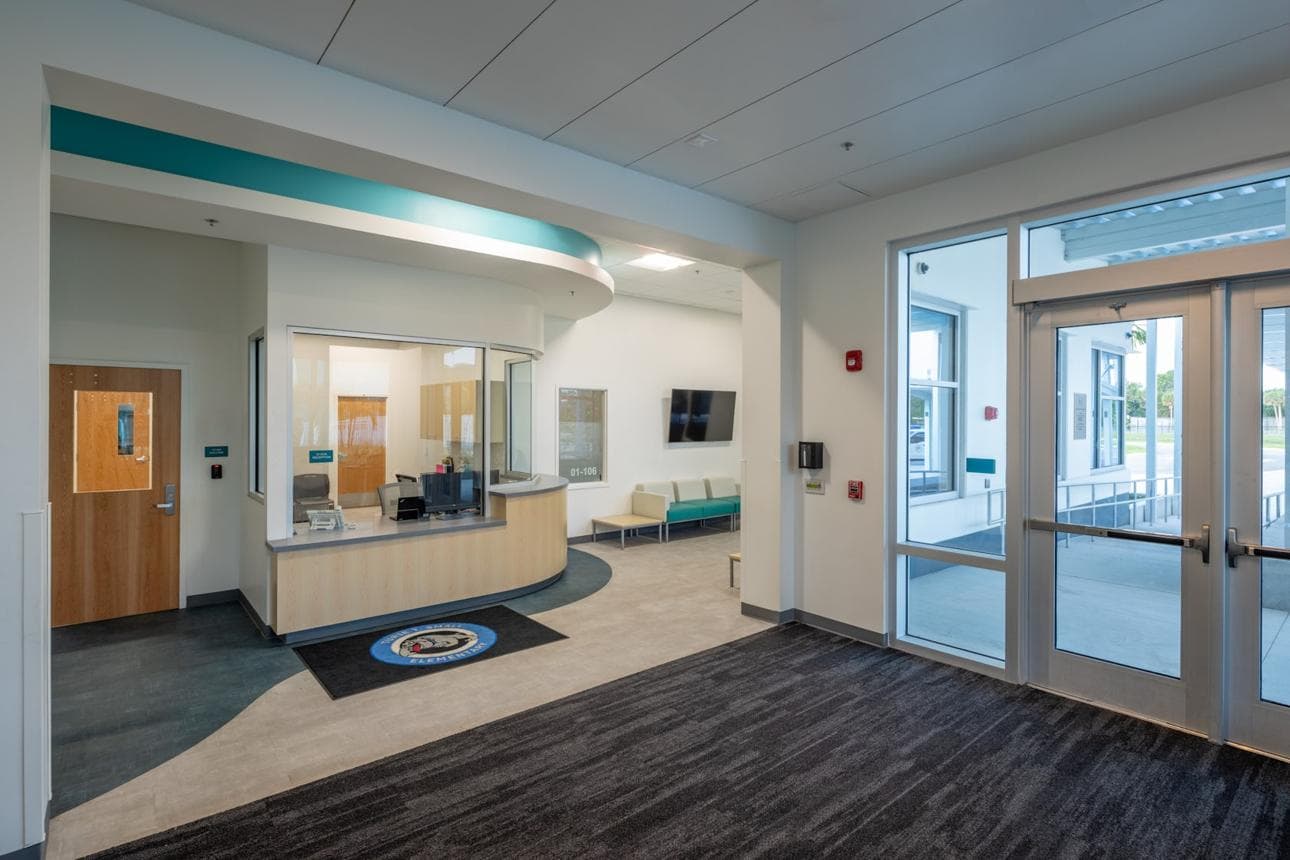 Modern elementary school reception area with a welcoming visitor check-in space.