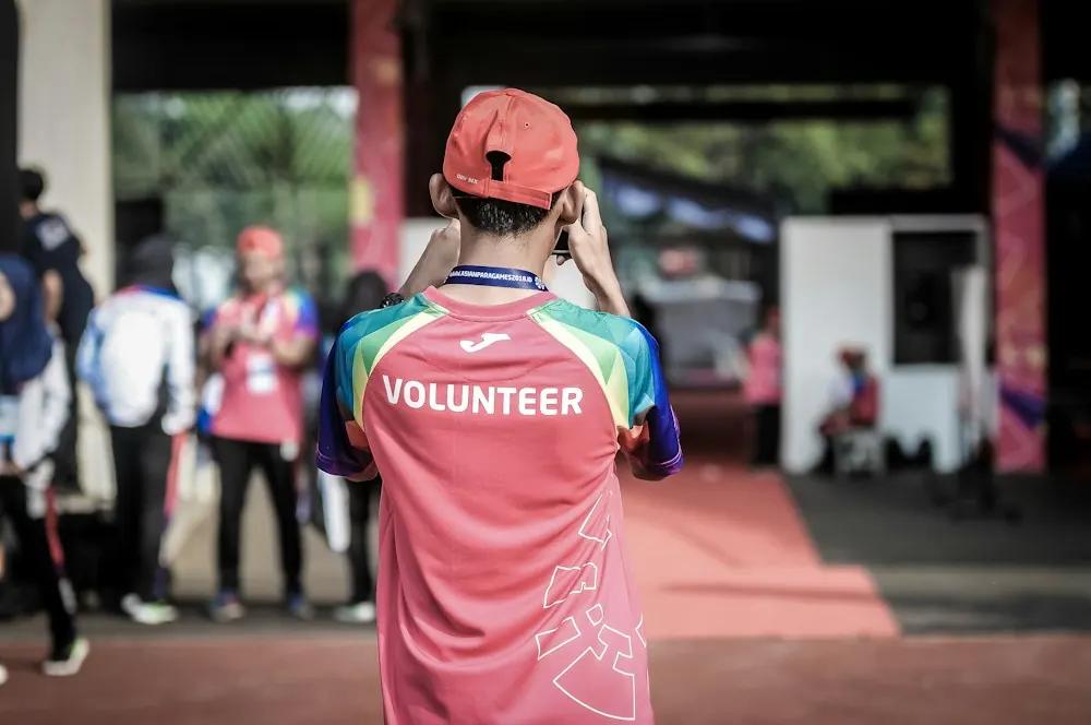 Volunteer wearing a volunteer shirt at an event